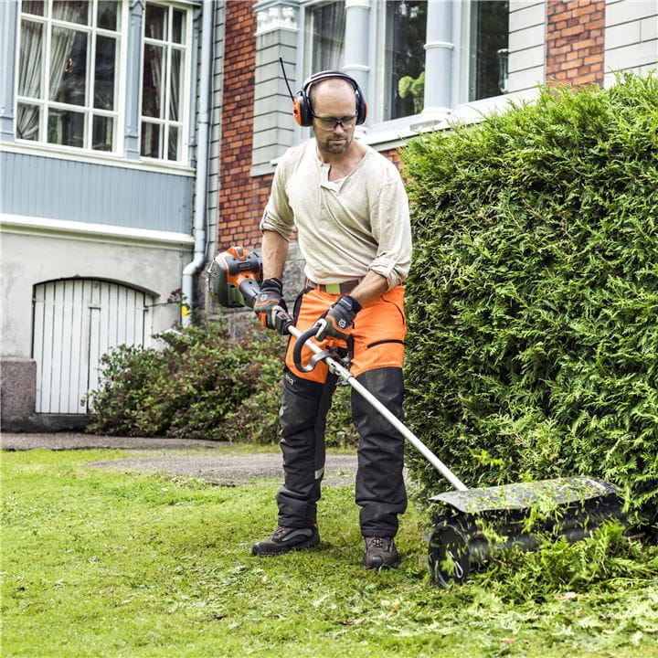 Man using sweeper combi trimmer